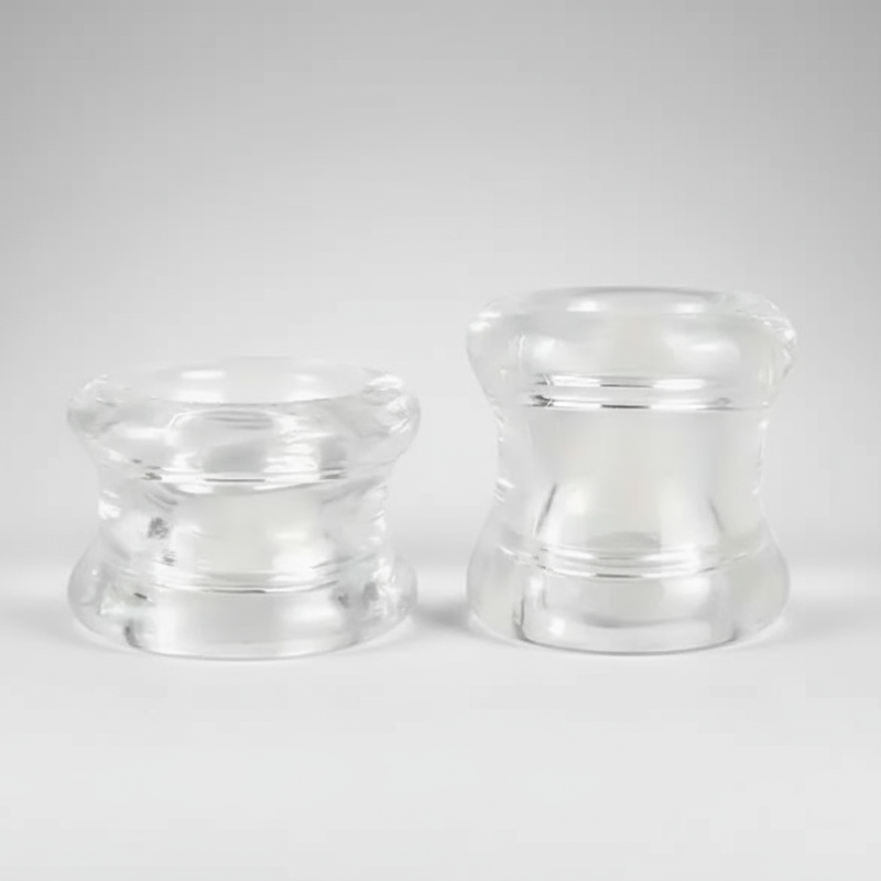 Two clear ball stretchers on a white background