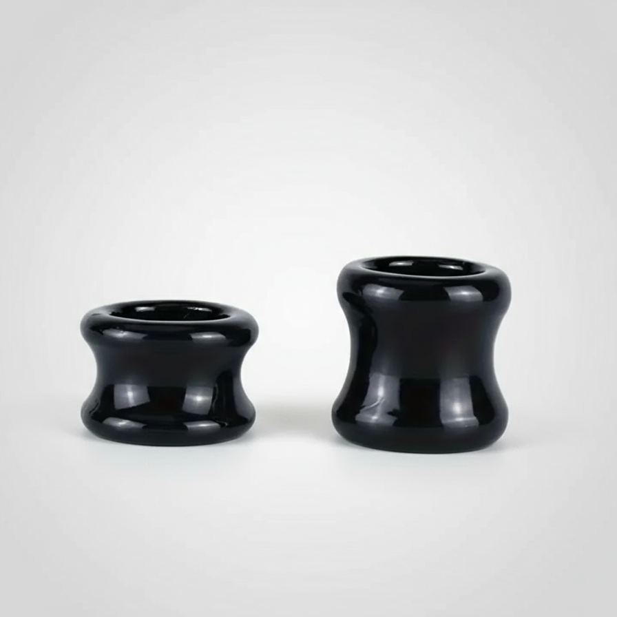 Two black ball stretchers on a white background