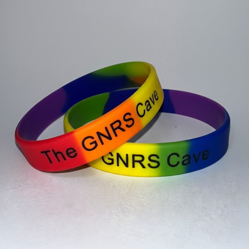 Colorful wristbands with 'The GNRS Cave' text on a white background
