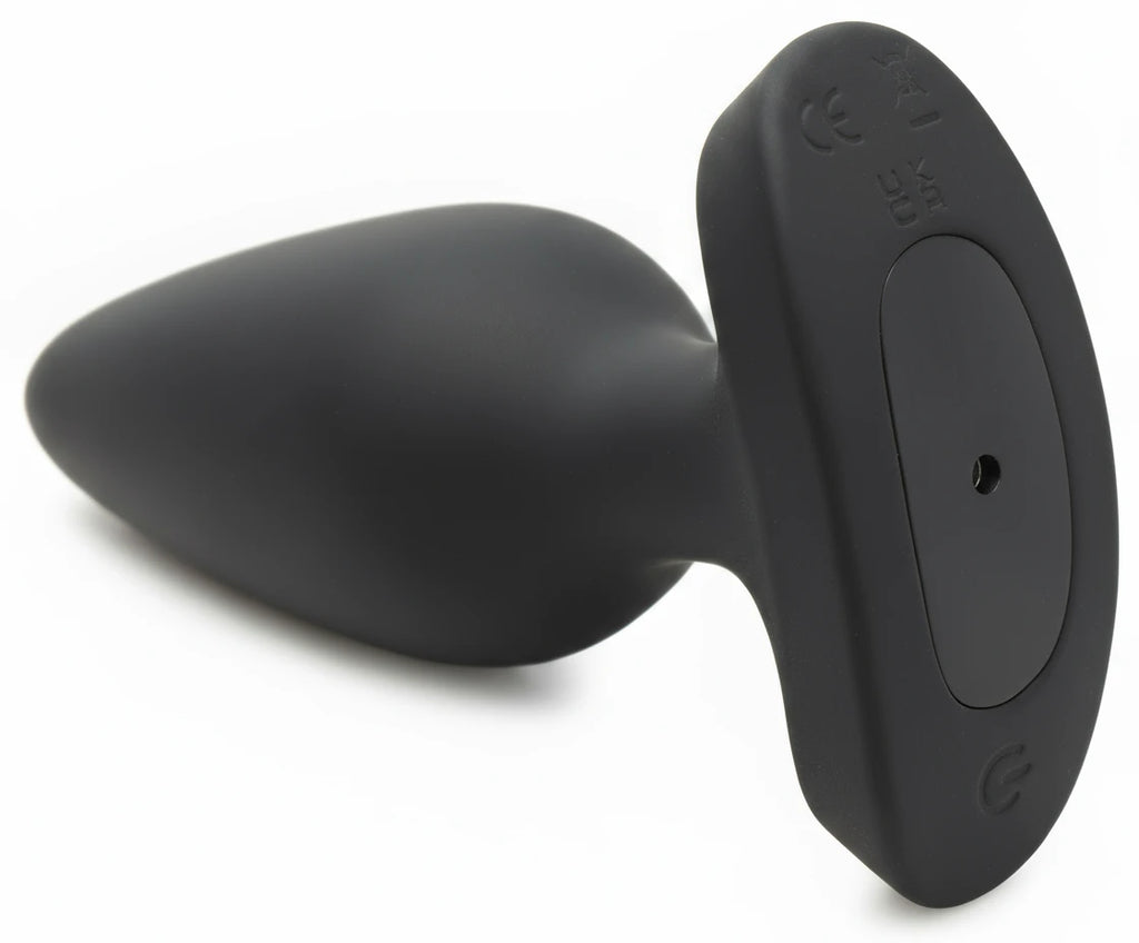 Black silicone butt plug on a white background