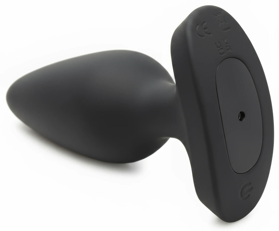 Black silicone butt plug on a white background